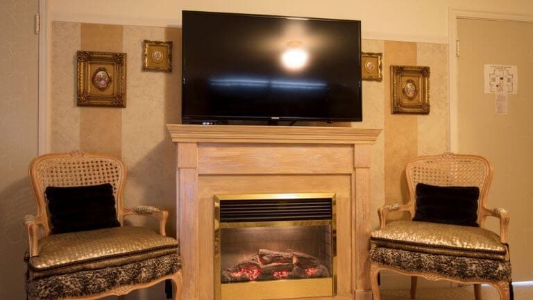 tv and fireplace in luxury suite